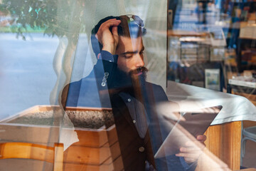 young businessman taking a break in a cafe