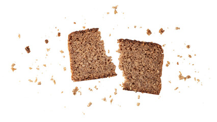 Broken slice of dark rye bread with crumbs flying isolated on white