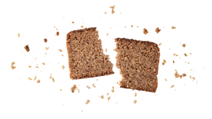 Broken slice of dark rye bread with crumbs flying isolated on white