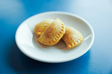 plate of dumplings on blue background