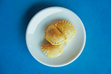 plate of dumplings on blue background