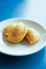 plate of dumplings on blue background