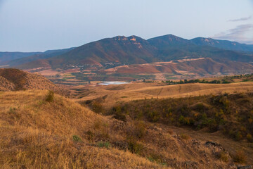 View of the mountain and small village. Beautiful sunset. Voskepar, Armenia.