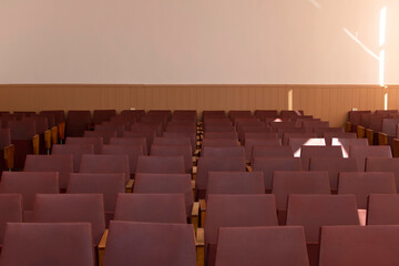 Rows of chairs in an empty conference room	