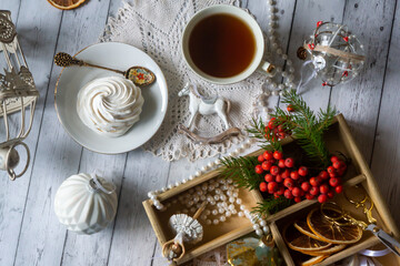 A cup of tea, New Year's toys, a calendar for the New Year 2024. Still life in vintage style.