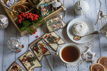 A cup of tea, New Year's toys, a calendar for the New Year 2024. Still life in vintage style.