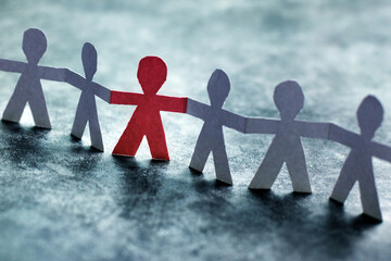 Inclusivity concept, inclusive group of people, paper humans holding hands together - Powered by Adobe