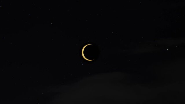 4k footage of an animated sequence or time-lapse of an annular solar eclipse against a beautiful starry sky with some grey clouds moving across the foreground