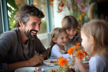 Obraz premium Happy Multiracial Parents and Their Children Laughing During Thanksgiving Dinner in the Dining Room