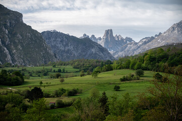 Fototapeta na wymiar Panoramic view on Naranjo de Bulnes or Picu Urriellu, limestone peak dating from Paleozoic Era, located in Macizo Central region of Picos de Europa, mountain range in Asturias, North Spain