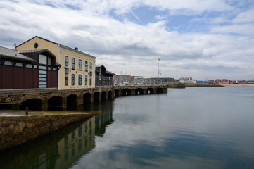 Fototapeta na wymiar View on houses, jachts, boats in port of Gijon, Asturias, Spain