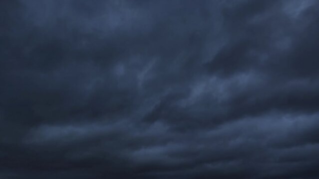 Very black sky with storms moving across the sky