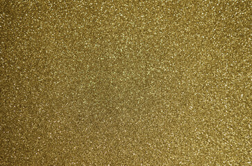 Fondo de brillos / textura glitter de color dorado/oro claro. Se puede usar como fondo de...
