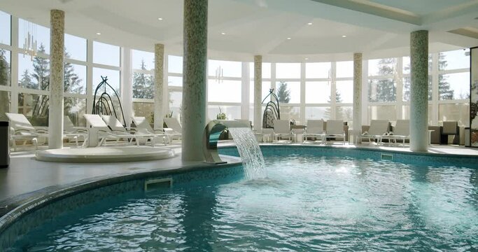 Sunbeds in the indoor swimming pool. Move camera Vercion 3