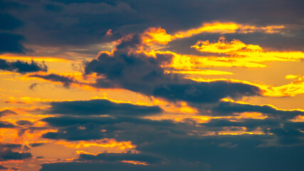 Lush colored clouds in the sky before sunset