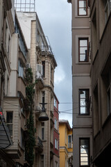 Fototapeta na wymiar View of old, historical, ornamental buildings on Istiklal Avenue in Istiklal street of Beyoglu, Istanbul.