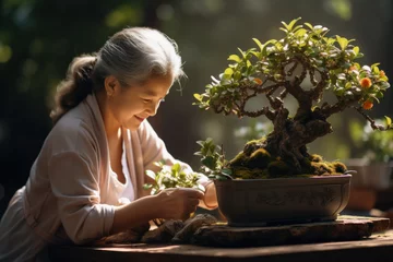  A grandmother and her grandchild gardening together, tending to bonsai trees. Concept of horticulture and family bonding. Generative Ai. © Sebastian