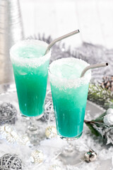 Refreshing Jack Frost cocktails surrounded by festive decorations.