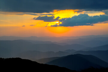 brightly colorful clouds in the evening sky. Lush colored clouds in the sky before sunset