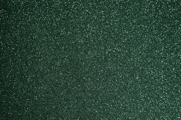 Obraz premium Fondo de brillos / textura glitter de color verde oscuro. Se puede usar como fondo de año nuevo o navidad.