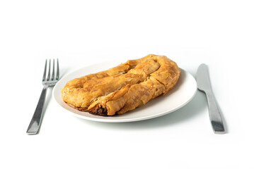 Meat Pie or Burek, traditional dish of Balkans, Middle East and Central Asia isolated on white background. Thin flaky dough filled with meat