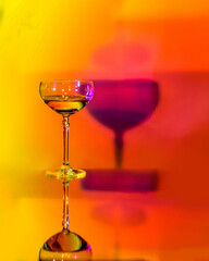 Martini glass with shadow on abstract background