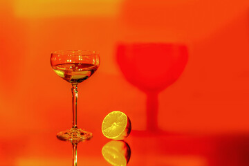 Martini glass with shadow on abstract background