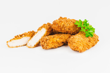 Chicken Breaded Fillet.Fast food. Breaded Chicken Inner Fillet on a White Background,Chicken Breaded Raw Meat. Fast cooking. Breaded chicken nuggets. Homemade food at home.