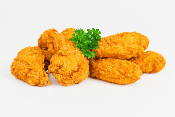 Semi-finished product, fried wings.Breaded Chicken wings with salad on a White Background,food at home.Fast homemade food.Chicken Breaded Raw Meat. Fast cooking.