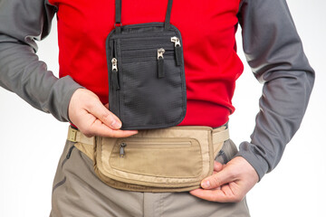 Male tourist with a waist bag for things and documents on a trip. belt bag with a zipper for things...