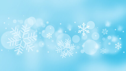 Fototapeta na wymiar Winter background with large and fluffy snowflakes and bokeh.