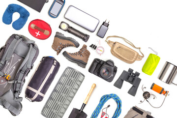 Set of tourist trekking items on white background. Top view of accessories for travel. Equipment for travel and hiking. Survival Items. - obrazy, fototapety, plakaty