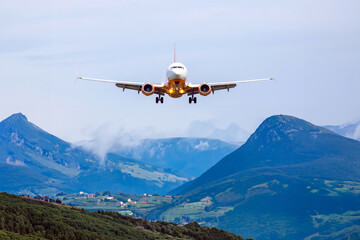 Fototapeta na wymiar passenger plane flies over the mountains. air transport industry