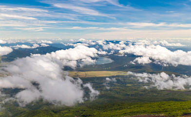 Blue lake covered with clouds view from the mountain