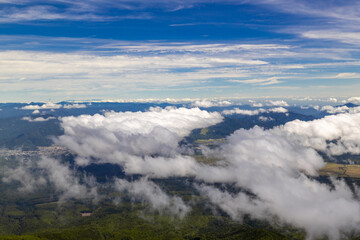 Fototapeta na wymiar Clouds over the summit of a mountain