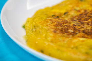 Traditional cassava puree grilled in a pan with pan meat (meat stew)