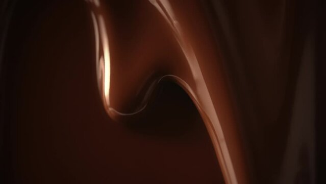 Close-up macro shot seamless dripping hot melted liquid chocolate flows, flowing molten chocolate or dark caramel sauce stream background. Chocolate drip. Confectionery. Pouring chocolate waves