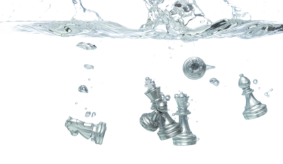 Silver Chess many Figure throw fall into clear water with air bubble. Unpredictable failure of business plan strategy and human resources organization risk management. White background isolated