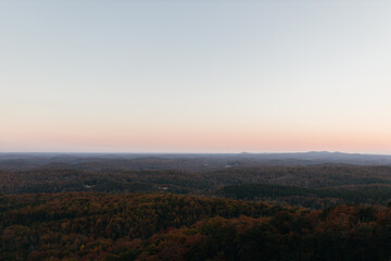 Naklejka na ściany i meble Sunset in the mountains in autumn. Landscape with mountains and picturesque sky at dawn. Horizon. Bird's eye view panorama. Bald Rock, Great Smoky Mountain National Park, South Carolina, USA