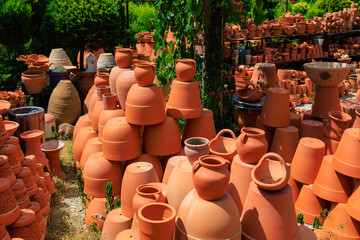 Clay products from pottery production. Background with selective focus and copy space