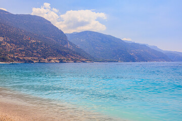 View of the mountains and the sea from Oludeniz beach, the blue lagoon. The cleanest beach with blue flag. Background