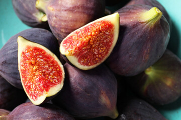 Many fresh ripe figs on plate, closeup