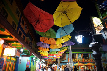 Decoration with colorful umbrellas. Night view of colorful umbrellas on a street in Guatapé