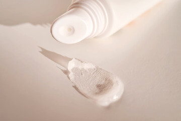 Hygienic moisturizing lip balm in a tube on a white background. - obrazy, fototapety, plakaty
