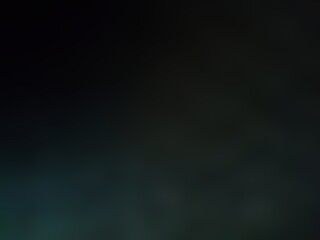 Abstract blurred background image of black color gradient used as an illustration. Designing posters or advertisements.