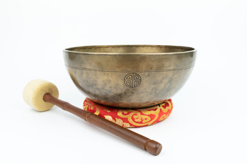 Tibetan handcrafted full moon singing bowl with white stick isolated on white background