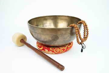 Tibetan handcrafted full moon singing bowl with a mallet (Striker stick)and japa mala (prayer beads) isolated on white background