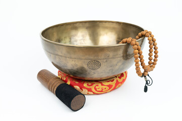 Tibetan handcrafted full moon singing bowl with a mallet (Striker stick)and japa mala (prayer beads) isolated on white background