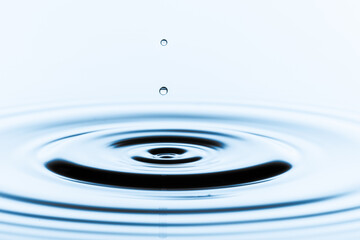 Liquid Fusion: Witness the moment a falling droplet fuses with the wat