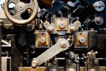 antique mechanism with gears and shafts assembled from brass